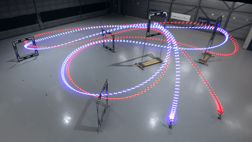 Multi-vehicle flight paths recorded in an autonomous systems test space.
